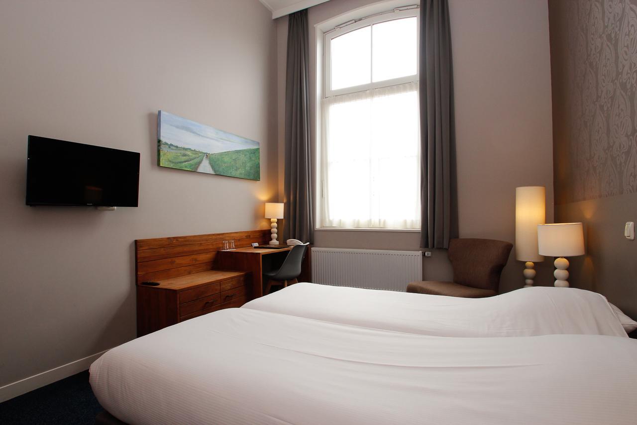 Hotel Aan De Singel Delfzijl Bagian luar foto